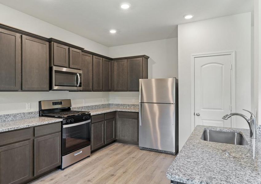 The kitchen of the Colorado has beautiful wood cabinetry.