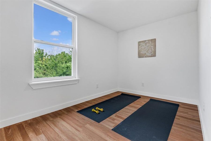 Exercise room with wood finished floors Exercise room with wood finished floors