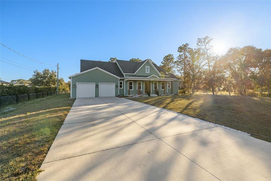 Front exterior of a new home in , Orlando, FL, highlighting curb appeal (Image 27). Front exterior of a new home in , Orlando, FL, highlighting curb appeal (Image 27).