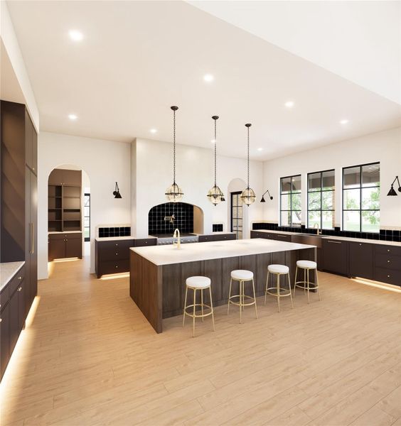 Additional Rendering of the kitchen highlighting the expansive custom cabinetry, large island with bar seating that tucks neatly underneath for clean, open flow and well appointed layout. Instant hot water tap added for convenience.