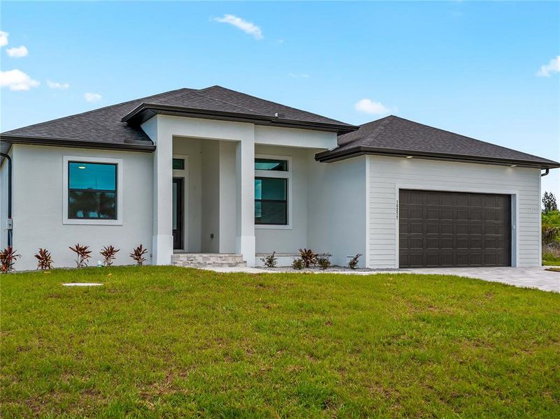Front exterior of a new home in , Port Charlotte, FL, highlighting curb appeal (Image 31). Front exterior of a new home in , Port Charlotte, FL, highlighting curb appeal (Image 31).