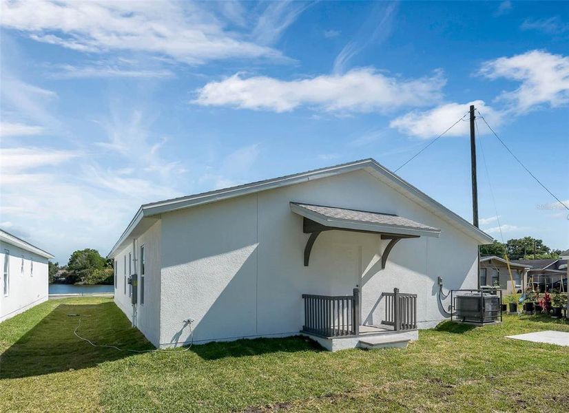 Rear Of Home With Covered Entry