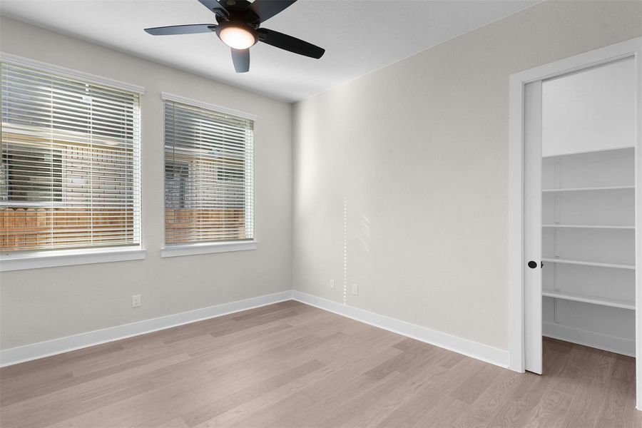 Unfurnished room featuring light wood-style floors and ceiling fan