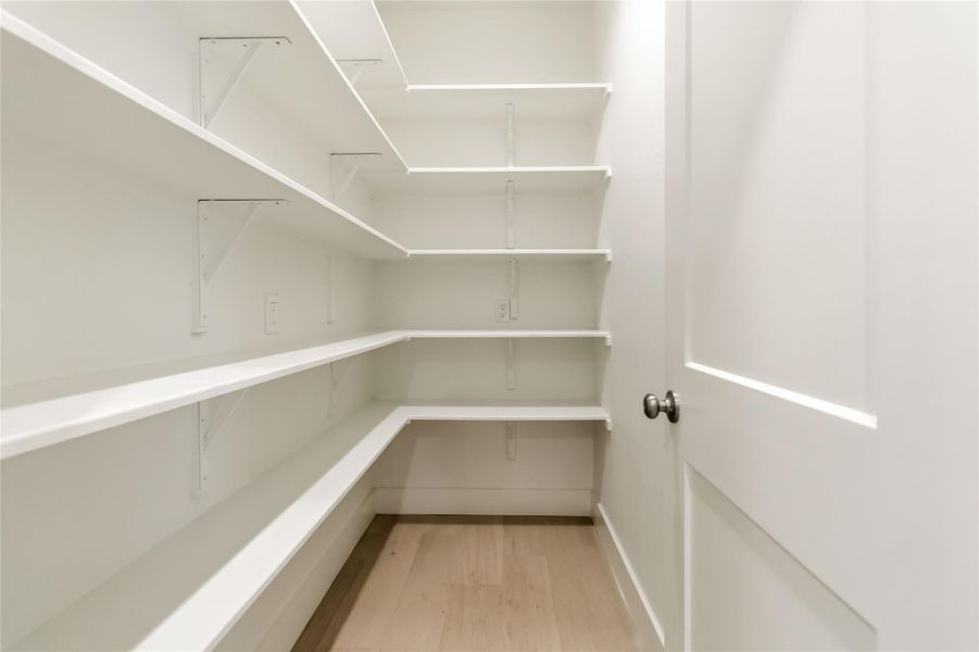 Oversized pantry with a 2nd pantry space on the other side of the kitchen