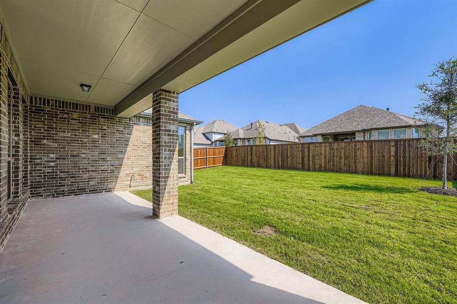 Fenced backyard featuring a patio area Fenced backyard featuring a patio area