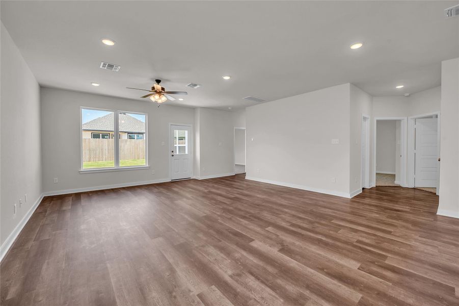 Unfurnished living room with recessed lighting, light wood-style flooring, and ceiling fan Unfurnished living room with recessed lighting, light wood-style flooring, and ceiling fan