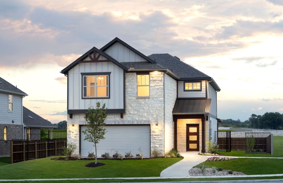Front exterior of a new home in Santa Rita Ranch, Liberty Hill, TX, highlighting curb appeal (Image 1). Front exterior of a new home in Santa Rita Ranch, Liberty Hill, TX, highlighting curb appeal (Image 1).