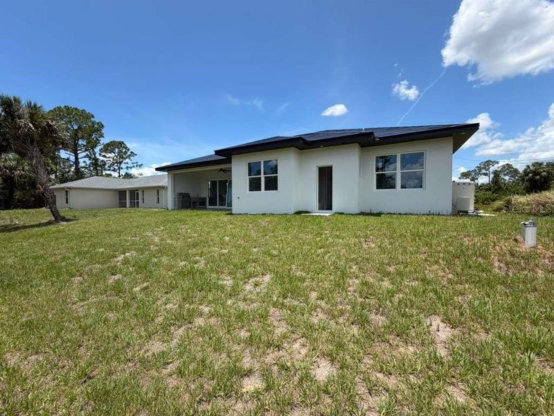 Exterior details and patio area of a home in , North Port (Image 25).