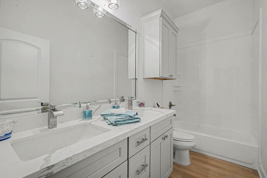 Secondary Bath with Double Sinks and Storage Secondary Bath with Double Sinks and Storage