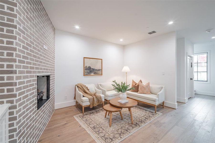 Living room with light hardwood / wood-style flooring