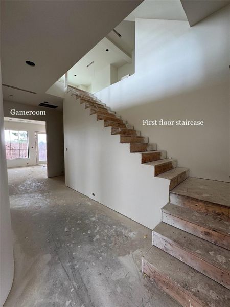 THREE-STORY entry. Photo of the first floor, opening up to the game room.