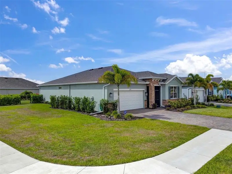 Front exterior of a new home in , North Fort Myers, FL, highlighting curb appeal (Image 23).