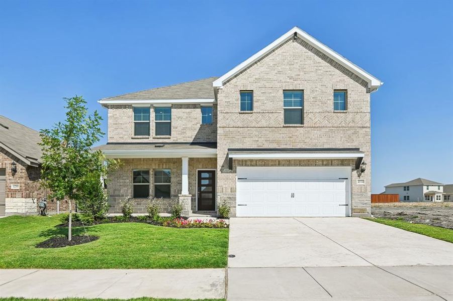 Front exterior of a new home in Lakehaven - Signature Series, Farmersville, TX, highlighting curb appeal (Image 1). Front exterior of a new home in Lakehaven - Signature Series, Farmersville, TX, highlighting curb appeal (Image 1).