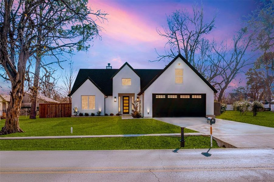 Modern inspired farmhouse featuring a yard