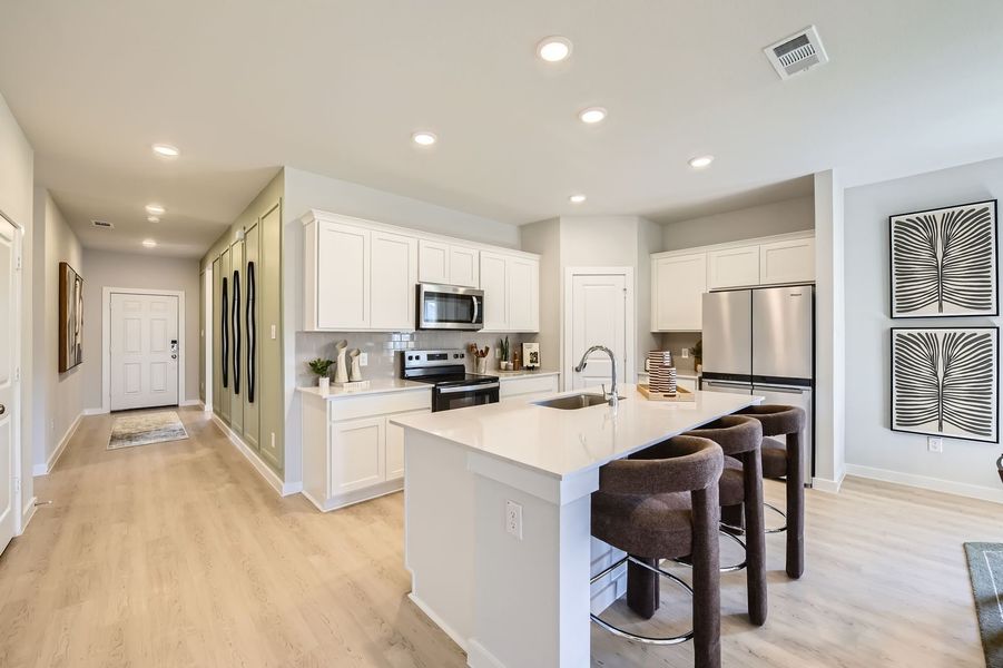 A kitchen with white cabinets. A kitchen with white cabinets.