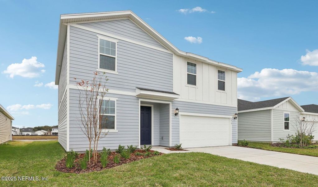 Front exterior of a new home in Lakes at Bella Lago - Signature Series, Green Cove Springs, FL, highlighting curb appeal (Image 16). Front exterior of a new home in Lakes at Bella Lago - Signature Series, Green Cove Springs, FL, highlighting curb appeal (Image 16).