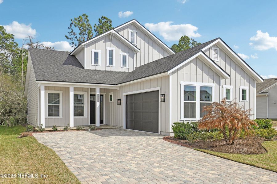 Front exterior of a new home in Middlebourne, St. Johns, FL, highlighting curb appeal (Image 2). Front exterior of a new home in Middlebourne, St. Johns, FL, highlighting curb appeal (Image 2).