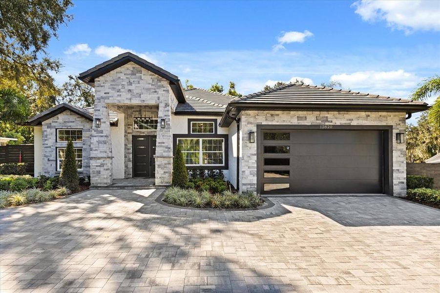 Front exterior of a new home in , Clermont, FL, highlighting curb appeal (Image 29). Front exterior of a new home in , Clermont, FL, highlighting curb appeal (Image 29).