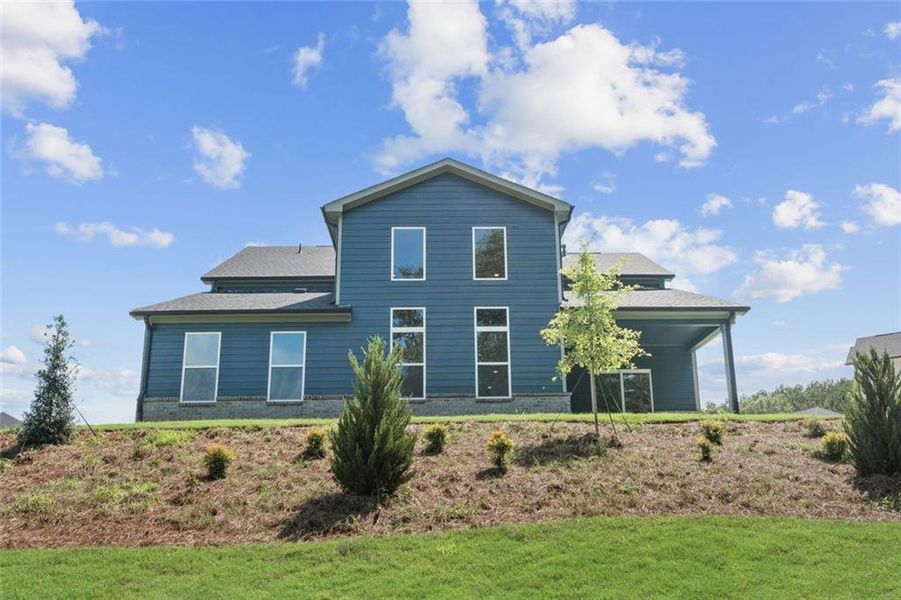 Front exterior of a new home in Windsong Estates, McDonough, GA, highlighting curb appeal (Image 22). Front exterior of a new home in Windsong Estates, McDonough, GA, highlighting curb appeal (Image 22).