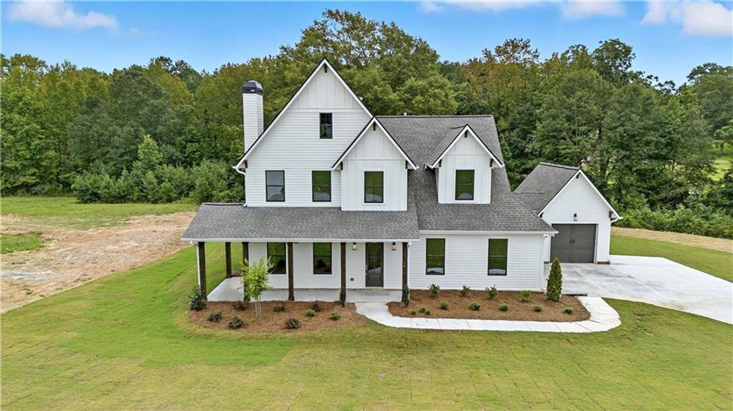 Front exterior of a new home in Old Town Estates, Dacula, GA, highlighting curb appeal (Image 32).