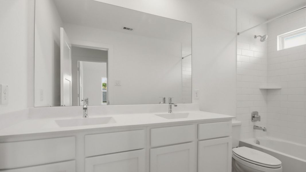 Furnished interior view inside a new home in Hills of Westlake, Conroe (Image 10).