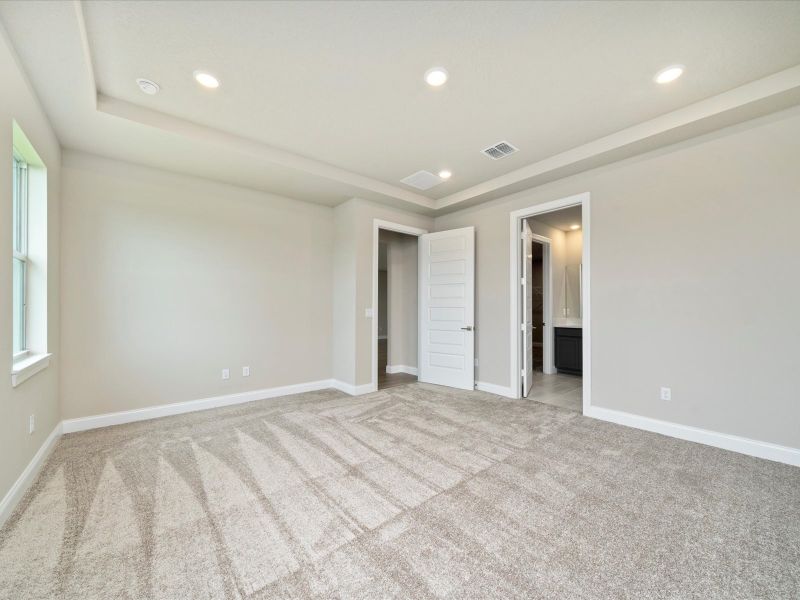 Primary Bedroom in the Onyx floorplan at 6383 NW Sweetwood Drive in Brystol at Wylder