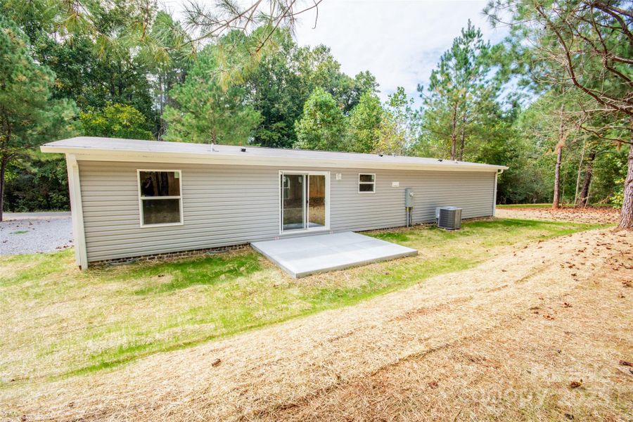 Front exterior of a new home in , Statesville, NC, highlighting curb appeal (Image 14).