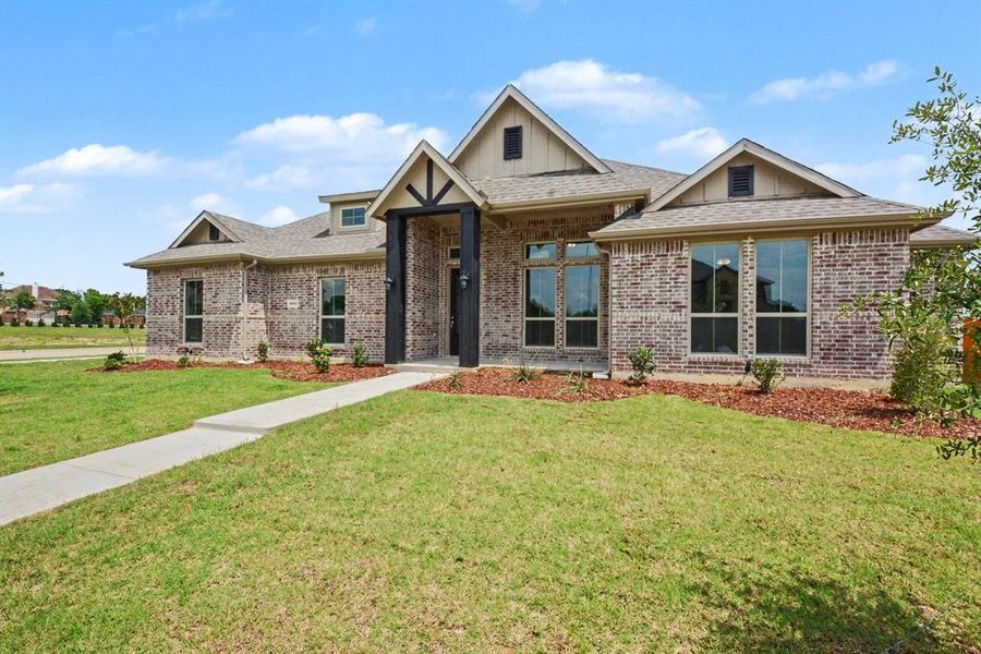 Front exterior of a new home in Ten Mile Creek Estates, DeSoto, TX, highlighting curb appeal (Image 18).