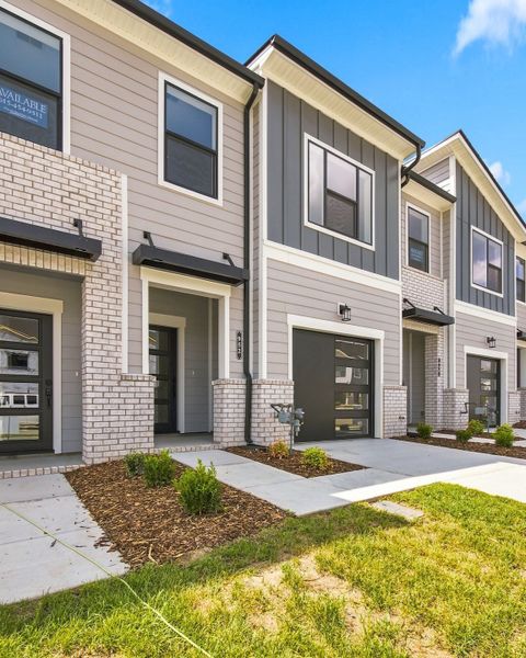Front exterior of a new home in Nexus Townhomes, Gallatin, TN, highlighting curb appeal (Image 18). Front exterior of a new home in Nexus Townhomes, Gallatin, TN, highlighting curb appeal (Image 18).
