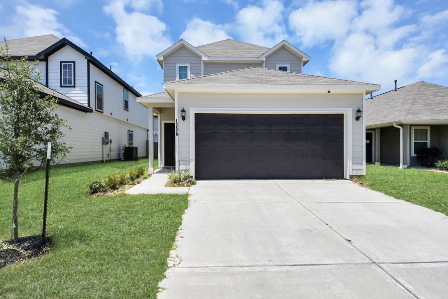 Front exterior of a new home in Townsend Reserve, Splendora, TX, highlighting curb appeal (Image 20). Front exterior of a new home in Townsend Reserve, Splendora, TX, highlighting curb appeal (Image 20).