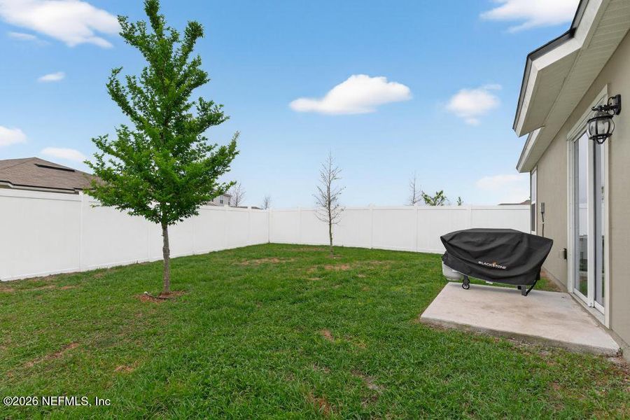 Exterior details and patio area of a home in Cross Creek Express, Green Cove Springs (Image 3).