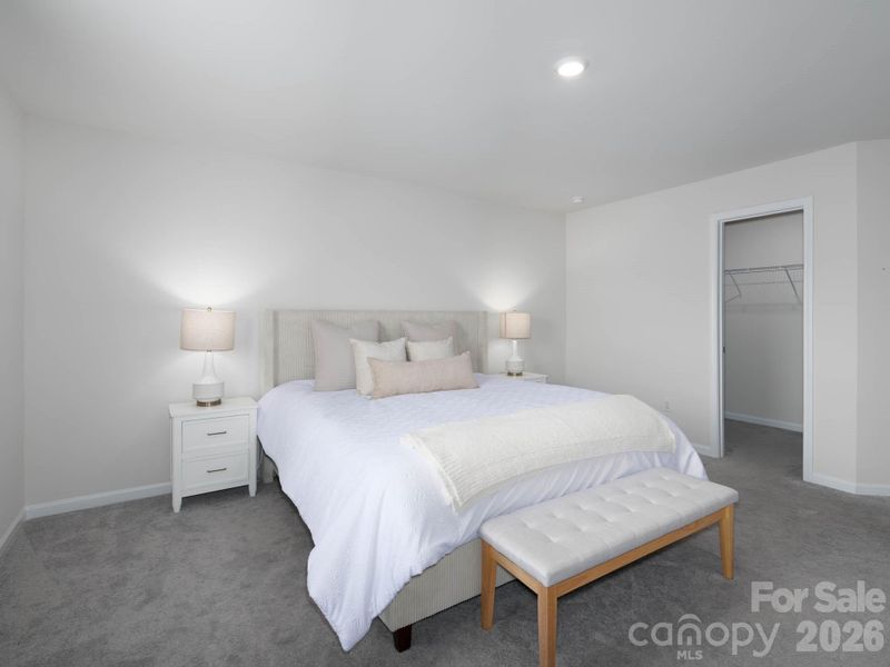 Primary en-suite features double walk-in closets