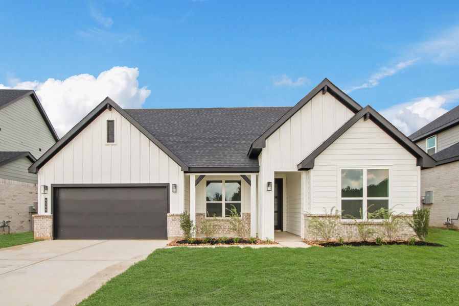 Front exterior of a new home in Silverthorne, Conroe, TX, highlighting curb appeal (Image 10). Front exterior of a new home in Silverthorne, Conroe, TX, highlighting curb appeal (Image 10).
