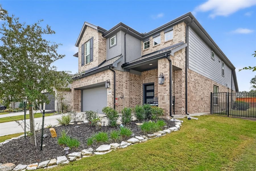 Front exterior of a new home in NorthGrove, Magnolia, TX, highlighting curb appeal (Image 2).