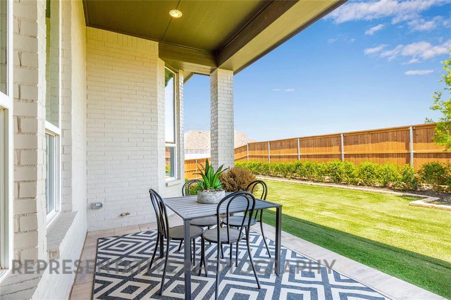Exterior details and patio area of a home in Tavolo Park, Fort Worth (Image 3).