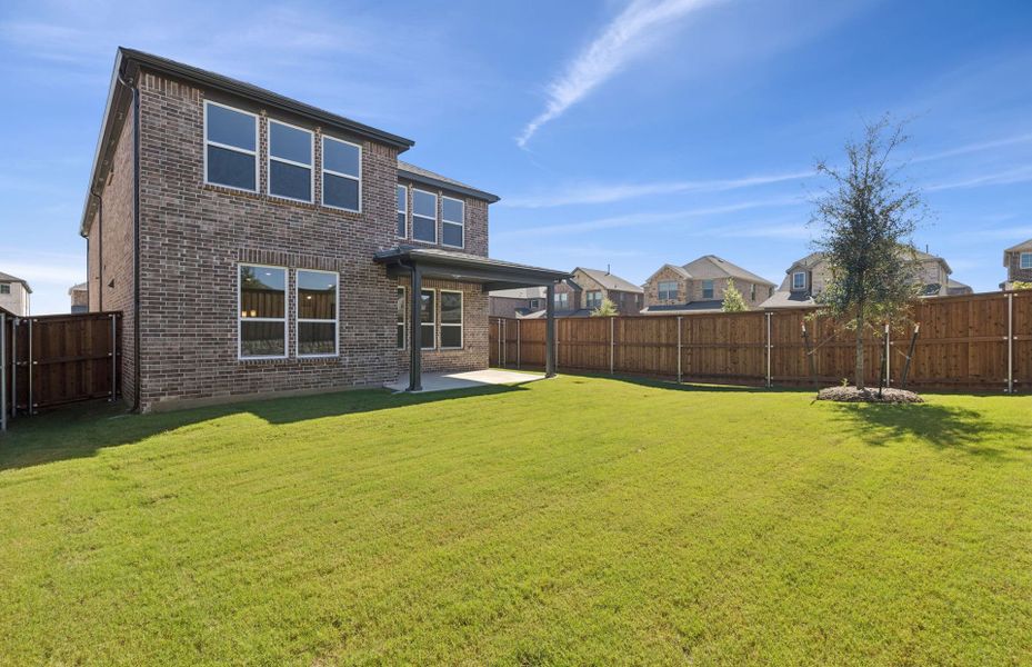 Exterior details and patio area of a home in Spiritas Ranch, Little Elm (Image 1).