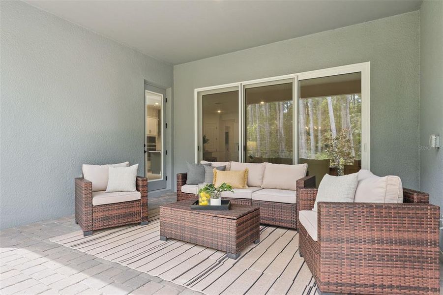 Exterior details and patio area of a home in Palms at Windermere, Windermere (Image 3).