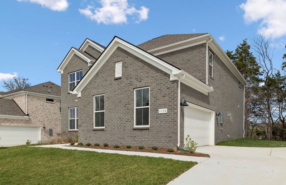 Front exterior of a new home in Devonshire, Mount Juliet, TN, highlighting curb appeal (Image 2). Front exterior of a new home in Devonshire, Mount Juliet, TN, highlighting curb appeal (Image 2).
