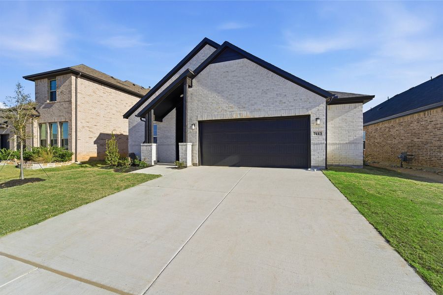 Front exterior of a new home in Sagebrook, Argyle, TX, highlighting curb appeal (Image 2). Front exterior of a new home in Sagebrook, Argyle, TX, highlighting curb appeal (Image 2).