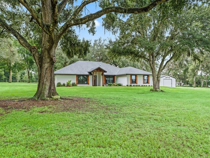 Front exterior of a new home in , Bushnell, FL, highlighting curb appeal (Image 23).