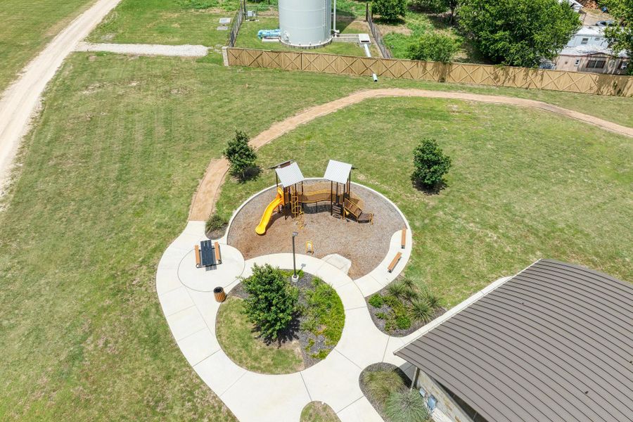 A vibrant playground surrounded by green space, offering recreation and relaxation.
