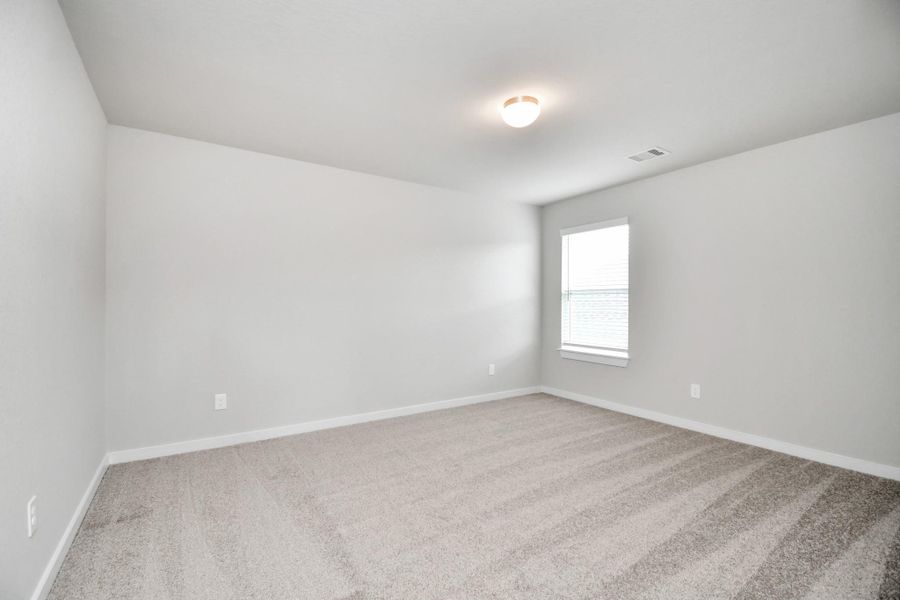 Generously sized secondary bedrooms featuring spacious closets, soft and inviting carpeting underfoot, large windows allowing plenty of natural light, and the added touch of privacy blinds for your personal retreat.