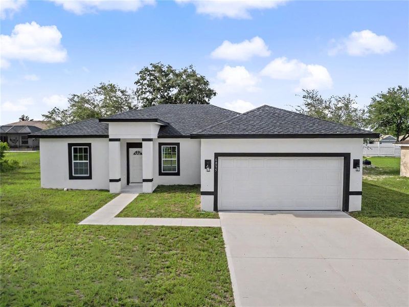 Front exterior of a new home in , Ocala, FL, highlighting curb appeal (Image 26).