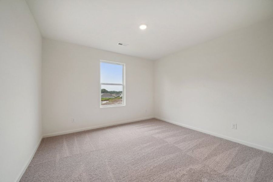 A room with a window and carpet. A room with a window and carpet.
