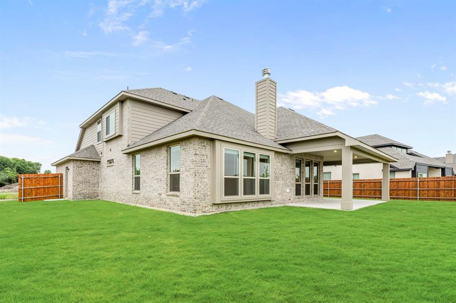 Front exterior of a new home in The Retreat at North Grove 70-75, Waxahachie, TX, highlighting curb appeal (Image 26). Front exterior of a new home in The Retreat at North Grove 70-75, Waxahachie, TX, highlighting curb appeal (Image 26).