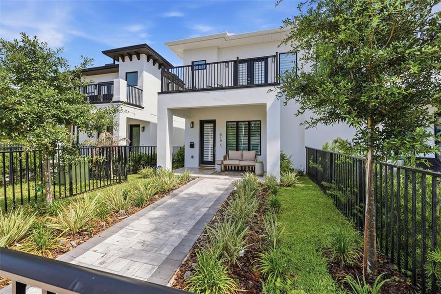 Front exterior of a new home in , Orlando, FL, highlighting curb appeal (Image 1). Front exterior of a new home in , Orlando, FL, highlighting curb appeal (Image 1).