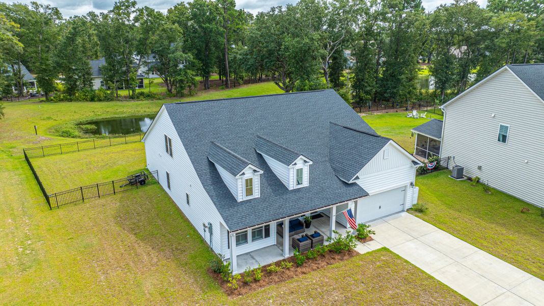 Front exterior of a new home in Saint John's Lake: Coastal Collection, Johns Island, SC, highlighting curb appeal (Image 21).