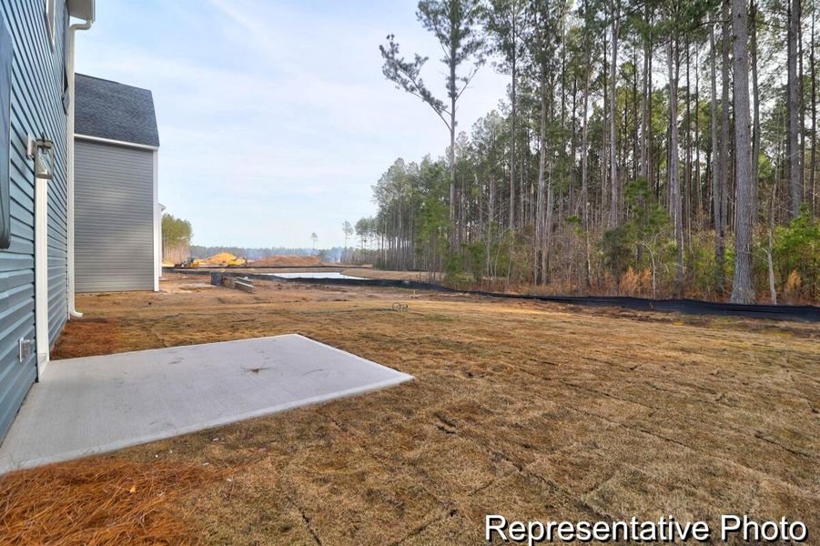 Front exterior of a new home in , Ravenel, SC, highlighting curb appeal (Image 2).