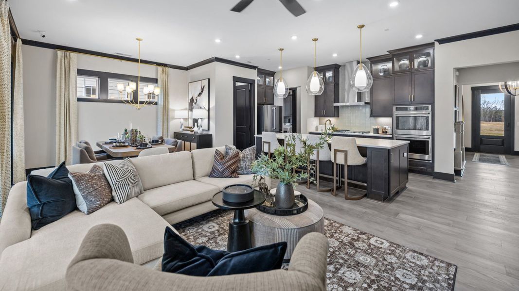 The Enthusiast Plan by DBR Homes kitchen and living area with modern features in Fort Mill, SC.