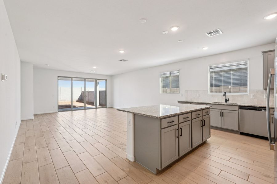 Kitchen, dining and great room. Finishes may vary by community.